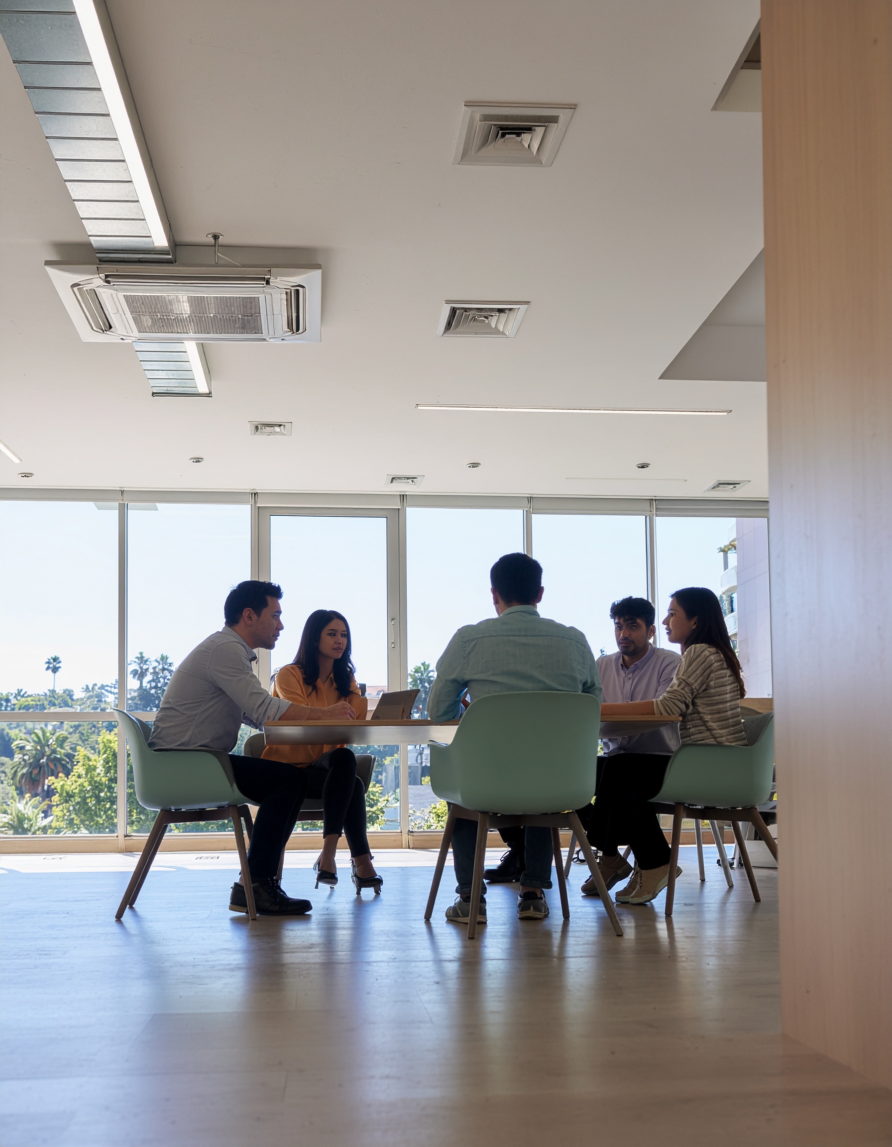 Business Meeting with Five People in Modern Office